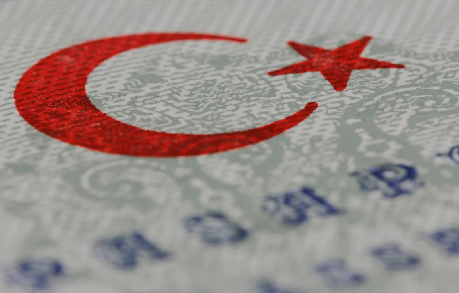 A Turkish passport open at the identity page